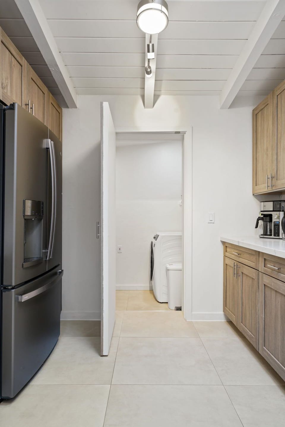 Laundry Room through the open door. Brand new washer and dryer 