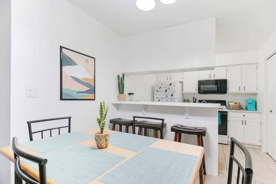 Comfortable kitchen table with 4  chairs, and 3 stools.