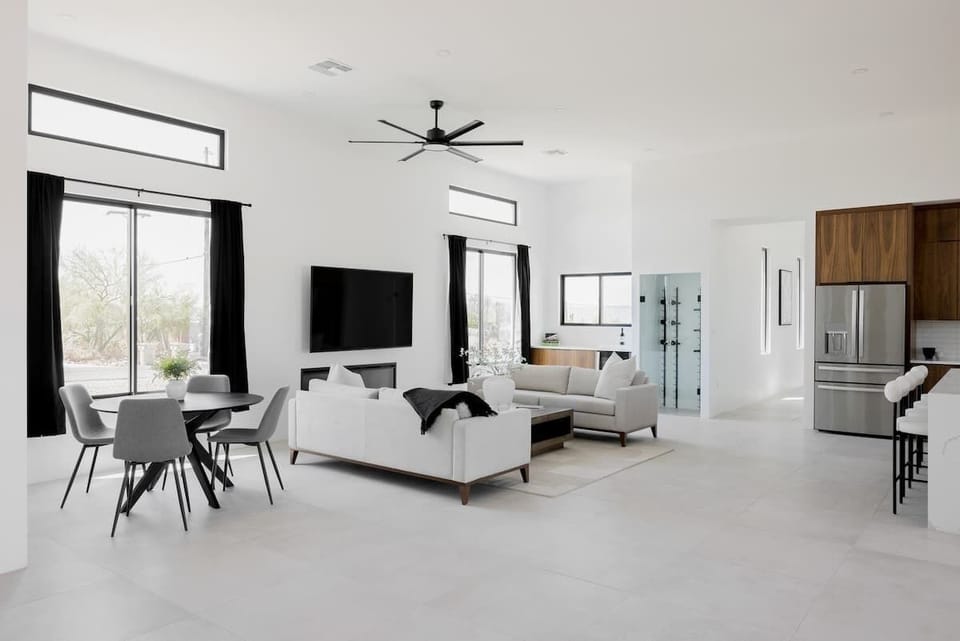 Spacious living room area with a 75 inch Smart TV.