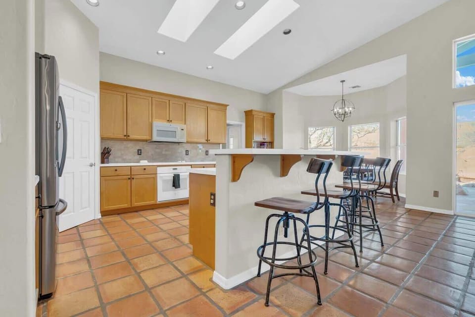 Kitchen with bar stools.