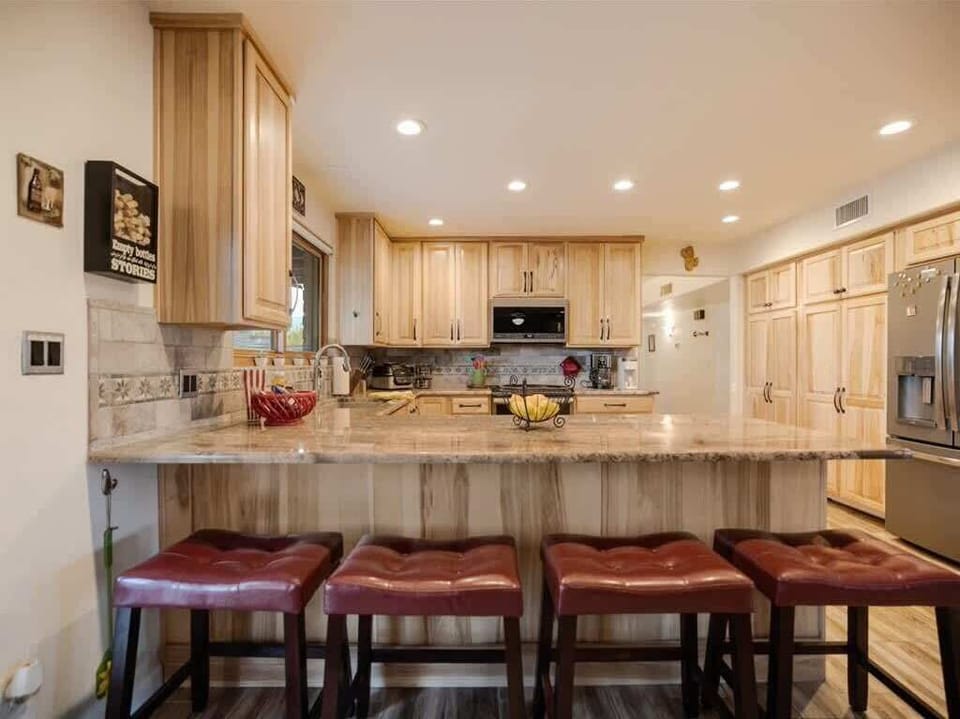 Spacious kitchen with seating.