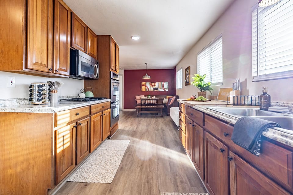 The heart of the house: a fully equipped kitchen flowing into the dining nook.
