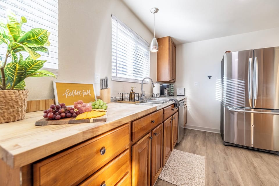 This charming kitchen, bathed in natural light, is bright, sunny, and stocked.