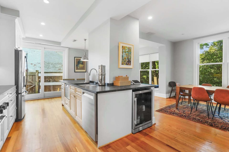 Chef's kitchen with bar seating for 4 and timeless finishes.