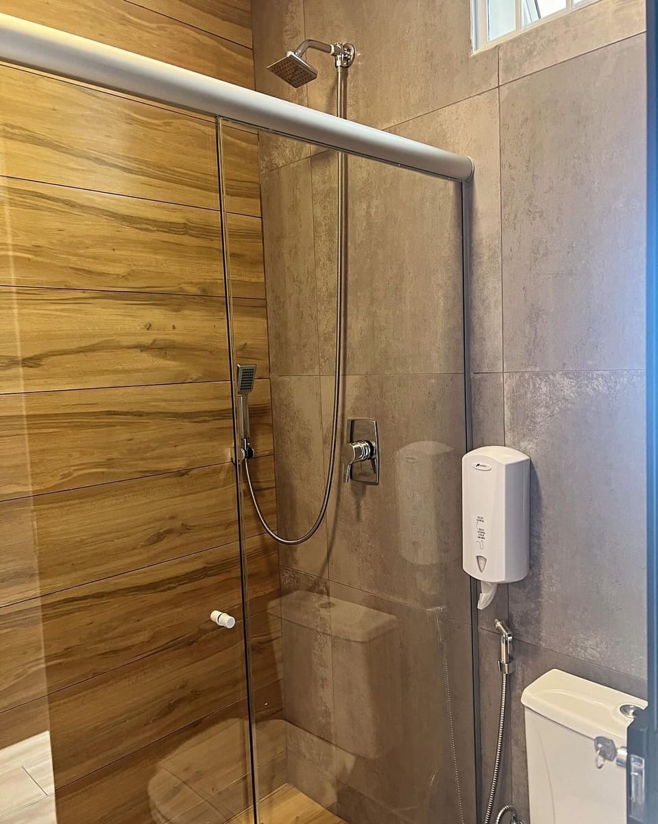 Family Room, Pool View | Bathroom | Shower, hair dryer, towels, soap