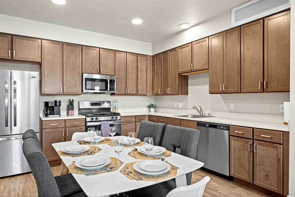 The kitchen comes fully stocked with dishes, cookware, and everything you need to feel at home.