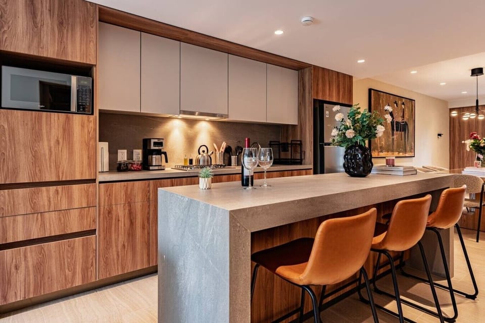 Cook at home in the modern kitchen featuring a spacious island.