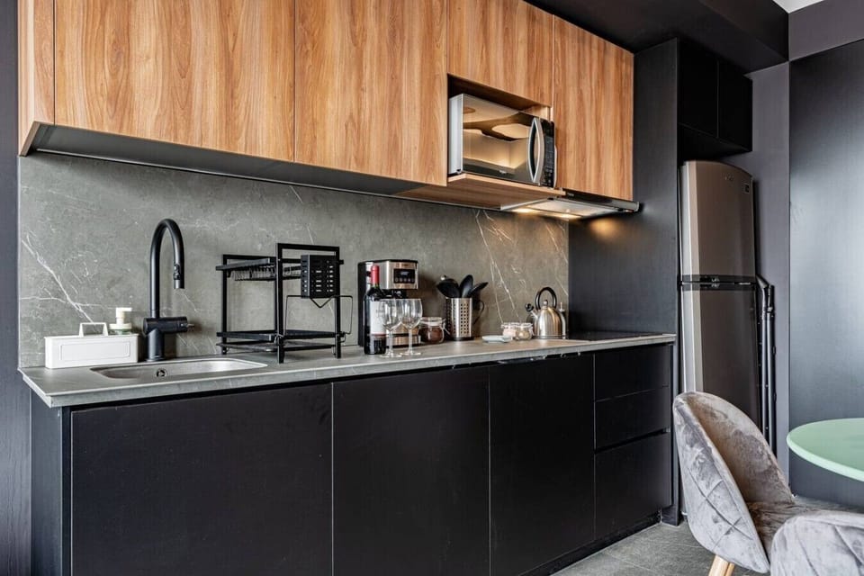 Cook with ease in the sleek, fully equipped kitchen featuring modern appliances.