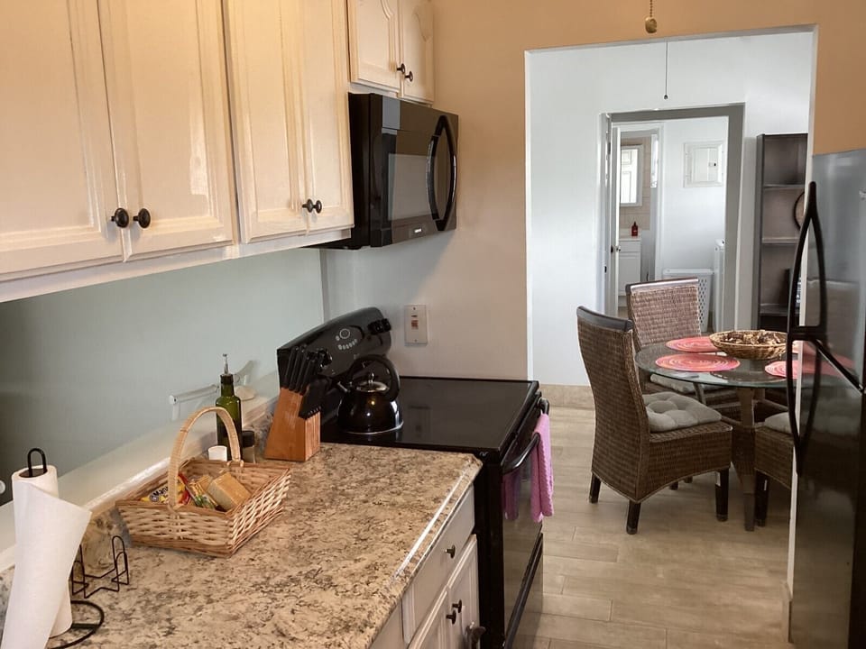 Family Condo, Balcony, Courtyard View | Private kitchen | Coffee/tea maker, full-size fridge, microwave, oven