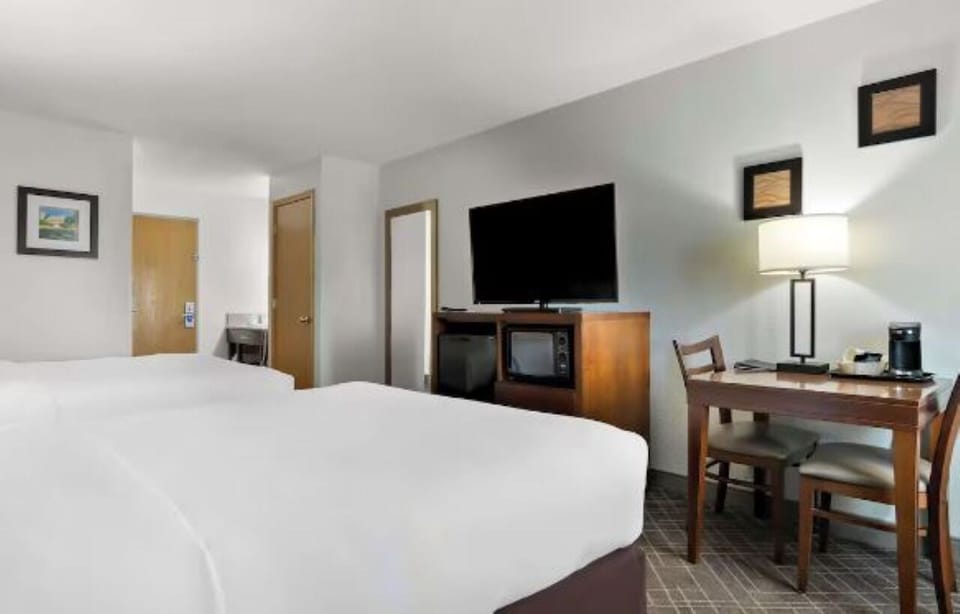 Enjoy meals or games at the table, steps from bed.