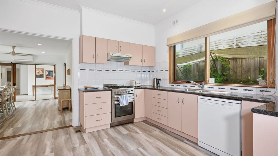 Prepare delicious meals in the spacious kitchen with generous bench space and garden views.