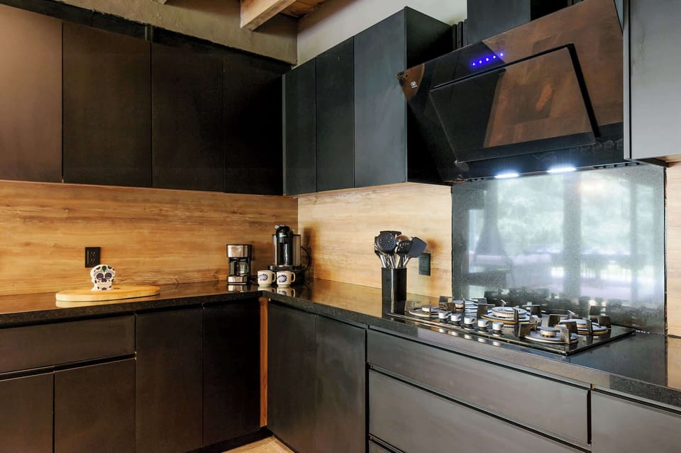 A built-in wine fridge and bar seating complete this indoor dining and entertaining space