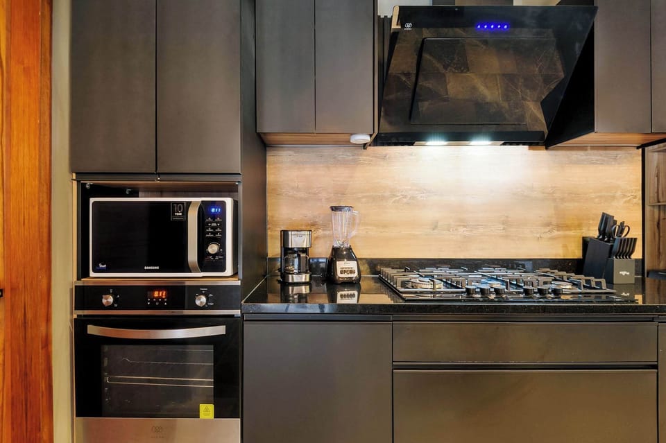 A built-in oven, blender, and coffee maker keep this kitchen ready for a crowd.