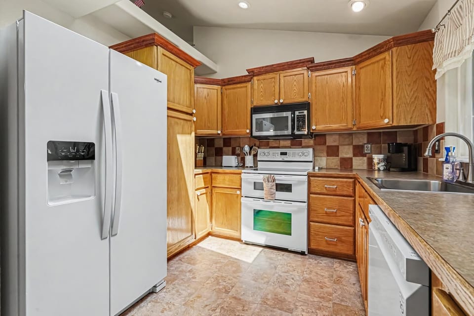 You can also enjoy the skylight in the kitchen, which brings in beautiful natural light and creates a bright, warm, and inviting space for cooking and gathering.
