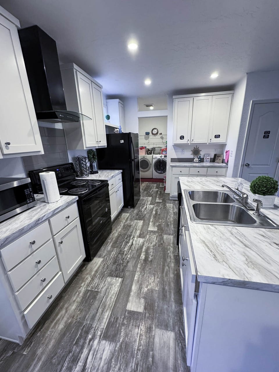 Open kitchen for fun family dinners and a washer and dryer for easy clean up. 