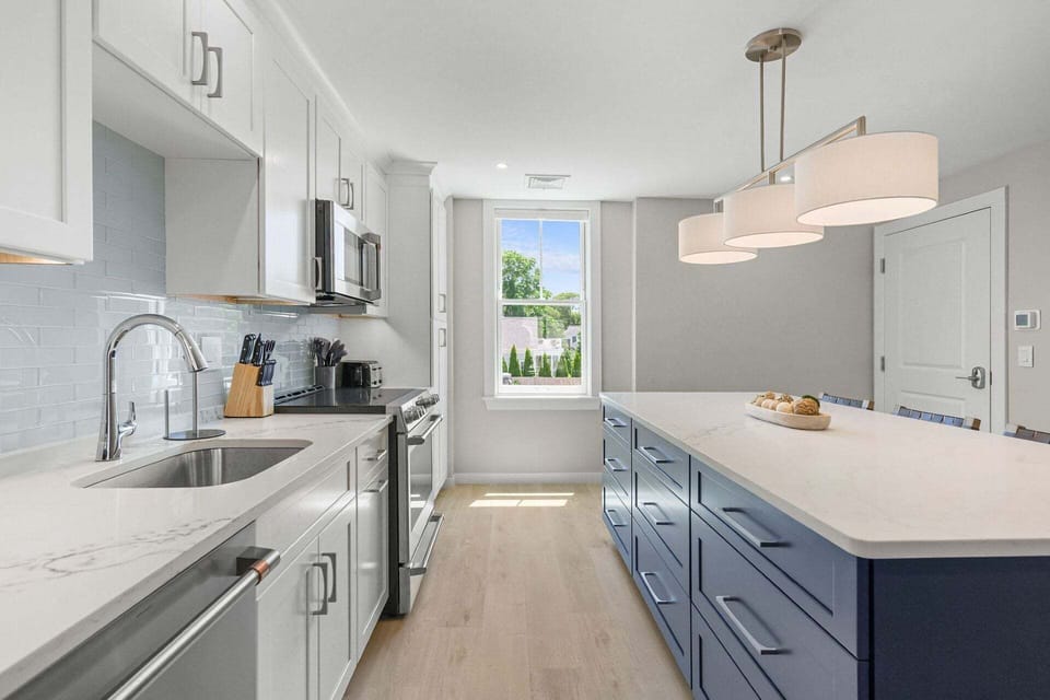 Plenty of counter space and a kitchen island with seating for 4