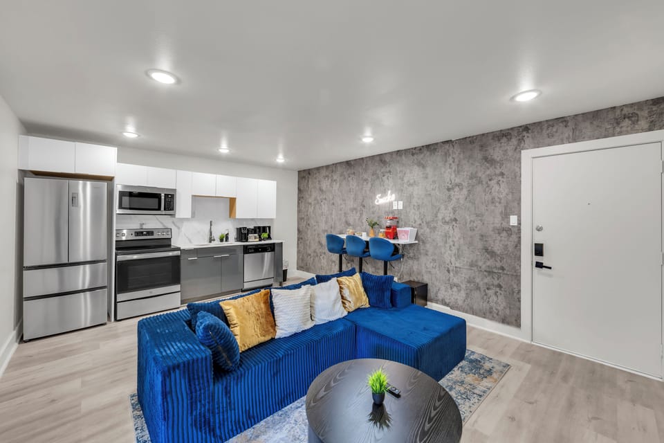 Modern open-concept stay with sleek kitchen and vibrant lounge seating