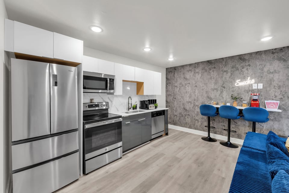Modern kitchen with stainless appliances and stylish breakfast bar