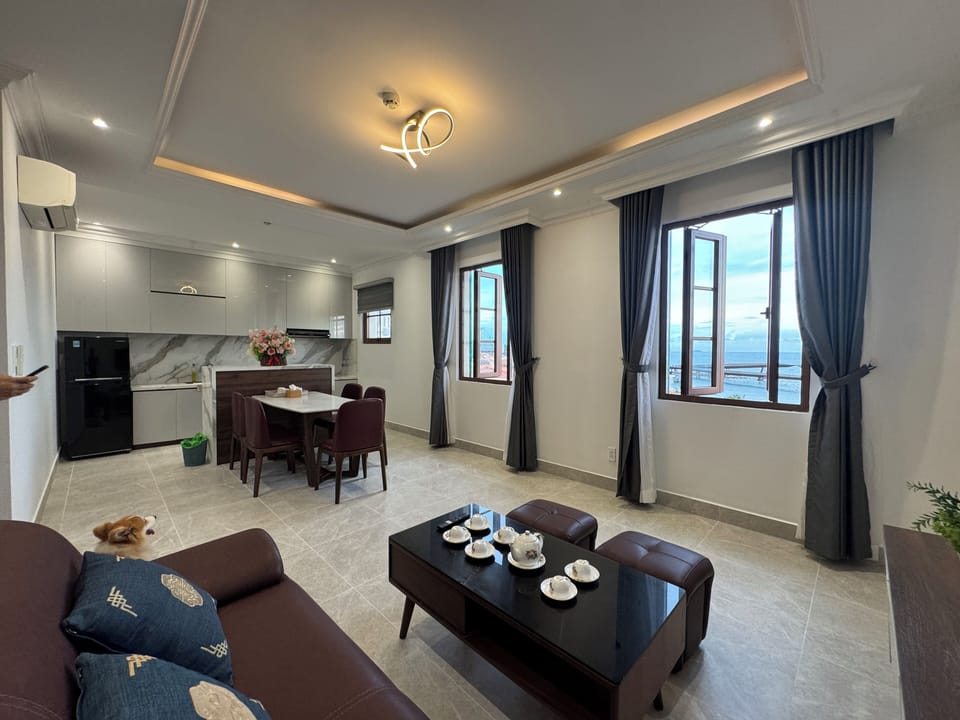 Deluxe Apartment, Beach View | Living area | 43-inch LCD TV with digital channels