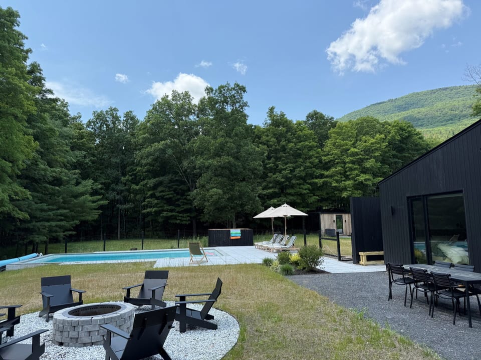 Gather poolside around the fire pit, with sweeping mountain and forest views all around.