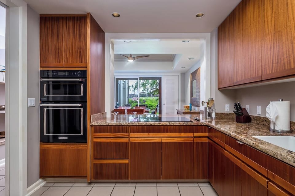 Fully equipped gourmet kitchen with stainless steel appliances and custom cabinetry.