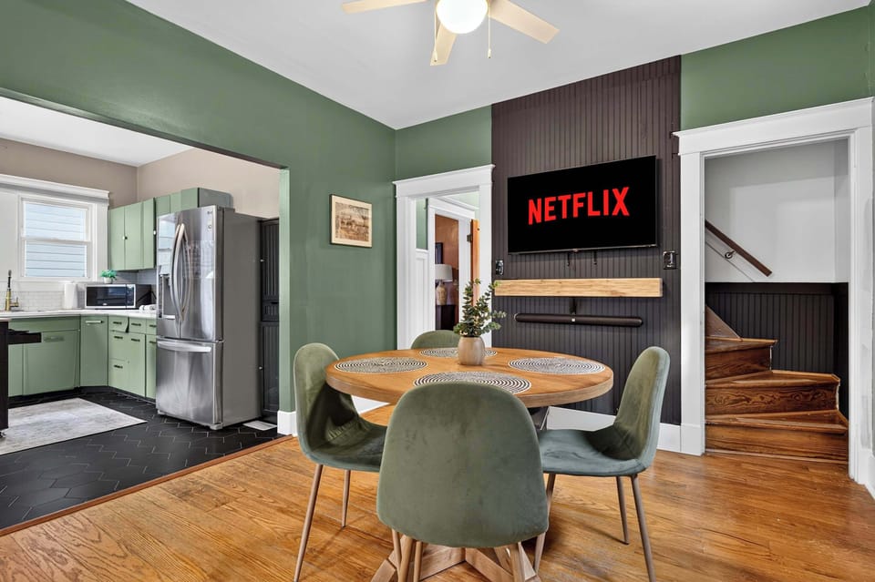Dining Area: Gather around the inviting dining area, featuring a spacious table and comfortable seating for shared meals, morning coffee, family conversations, or planning the day ahead.