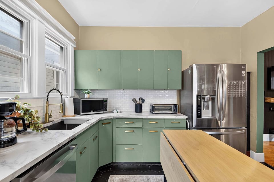 Kitchen: This welcoming kitchen offers plenty of workspace, modern appliances, and useful cooking essentials, making it easy to prepare morning coffee or family dinners.