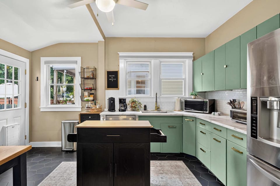Kitchen: This welcoming kitchen offers plenty of workspace, modern appliances, and useful cooking essentials, making it easy to prepare morning coffee or family dinners.