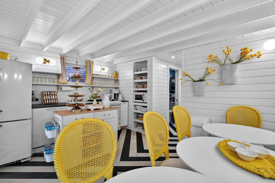 Dining Area: Gather around the spacious dining table in a bright, inviting dining area perfect for family meals, game nights, or enjoying takeout after a day of exploring.