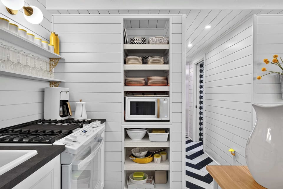 Kitchen: Enjoy a bright and colorful kitchen designed for both style and function, complete with modern appliances, cookware, and spacious countertops.