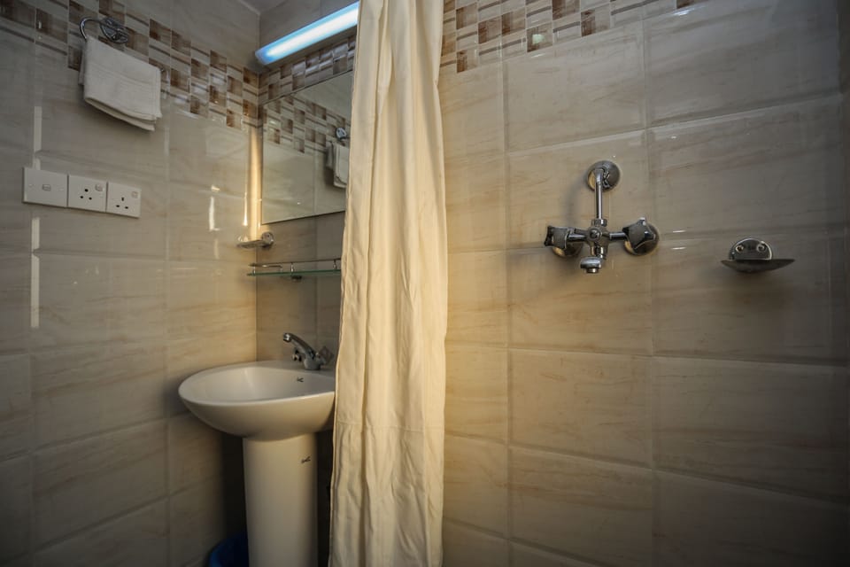 Shower, free toiletries, slippers, towels