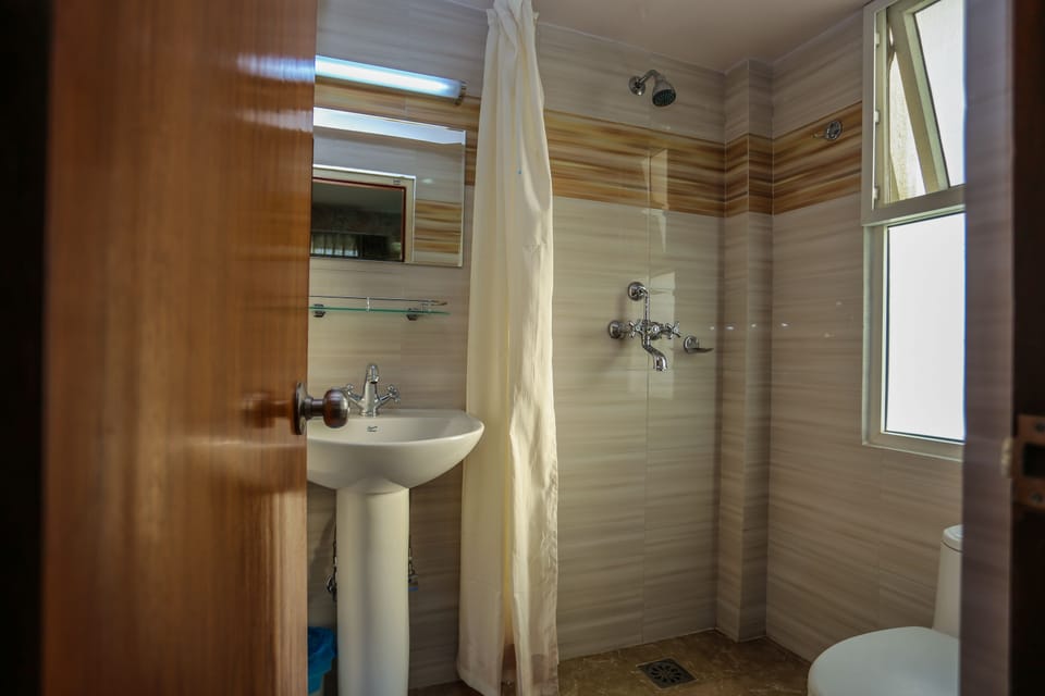 Business Suite, City View | Bathroom | Shower, free toiletries, slippers, towels