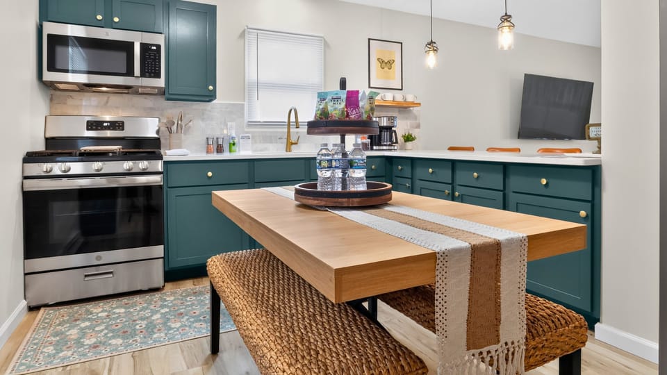 Beautiful finishes, ss appliances, and island seating create a welcoming kitchen.