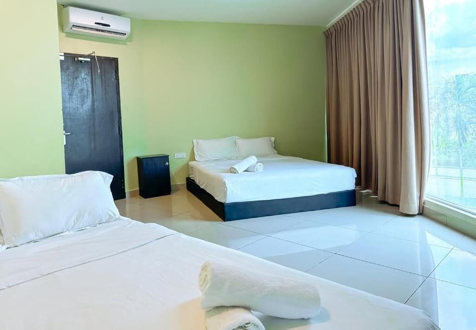 Deluxe Quadruple Room, City View | Iron/ironing board, WiFi (free)