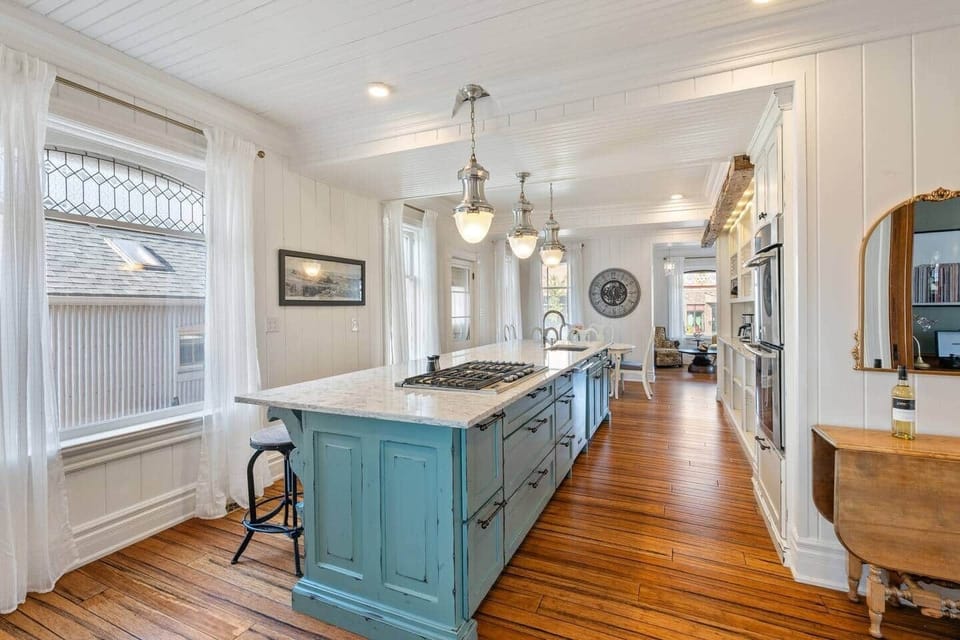 Bright, spacious and designed for gathering, the chef's kitchen features an oversized island with seating for six, premium appliances and an open layout that naturally brings everyone together.