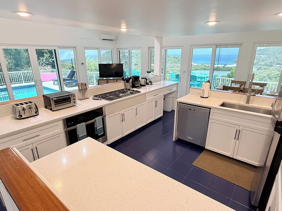 Your kitchen looks out to the living and dining area...