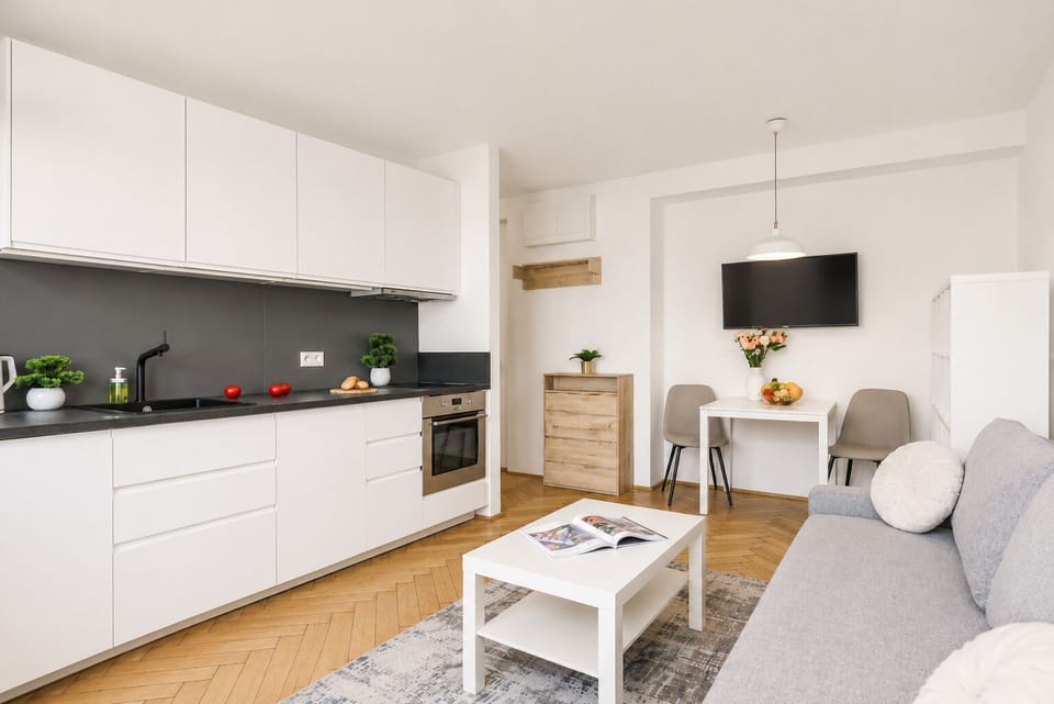 Deluxe Apartment, City View | Living area | 30-inch flat-screen TV with satellite channels, Netflix