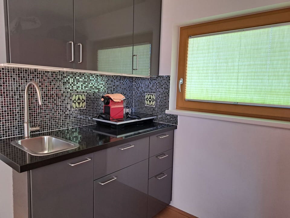 Kitchen, Countertop, Cabinetry, Kitchen Sink, Kitchen Appliance, Interior Design, Wood, Flooring, Home, Plumbing Fixture
