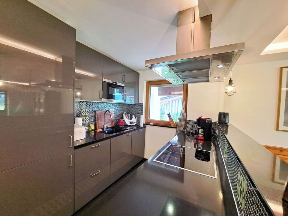 Kitchen, Countertop, Kitchen Appliance, Interior Design, Cabinetry, Flooring, Furniture, Wood, Major Appliance, Ceiling