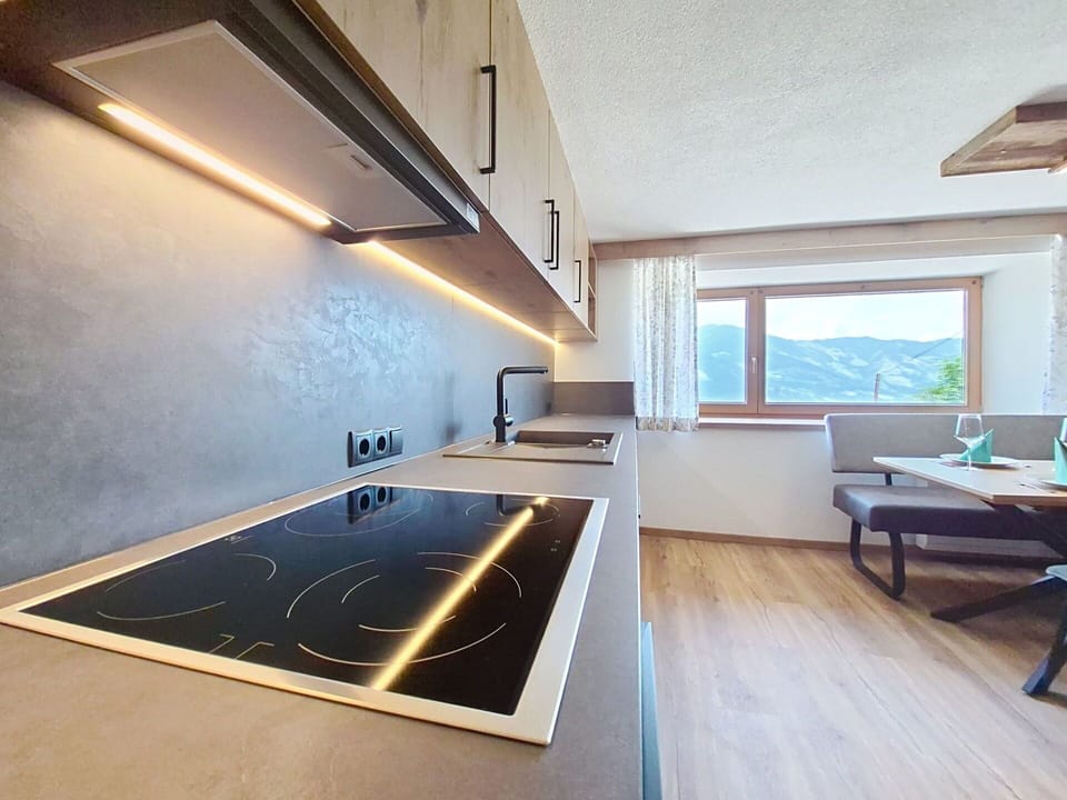 Interior Design, Flooring, Ceiling, Kitchen, Countertop, Light Fixture, Lighting, Room, Floor, Home