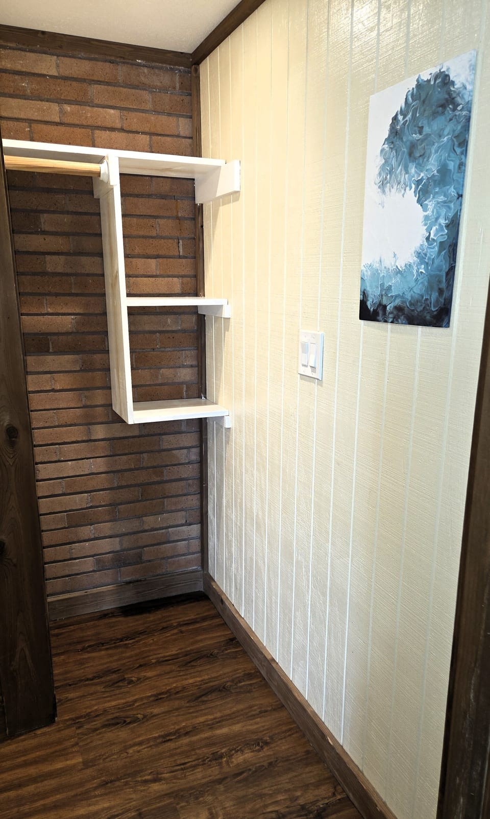 The bathroom has a small closet for storage