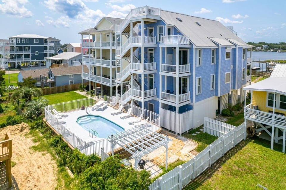 Backyard: a spacious in-ground saltwater pool, loungers and a charcoal grill, just 250 steps from the beach, with plenty of room to share with Apartment A guests