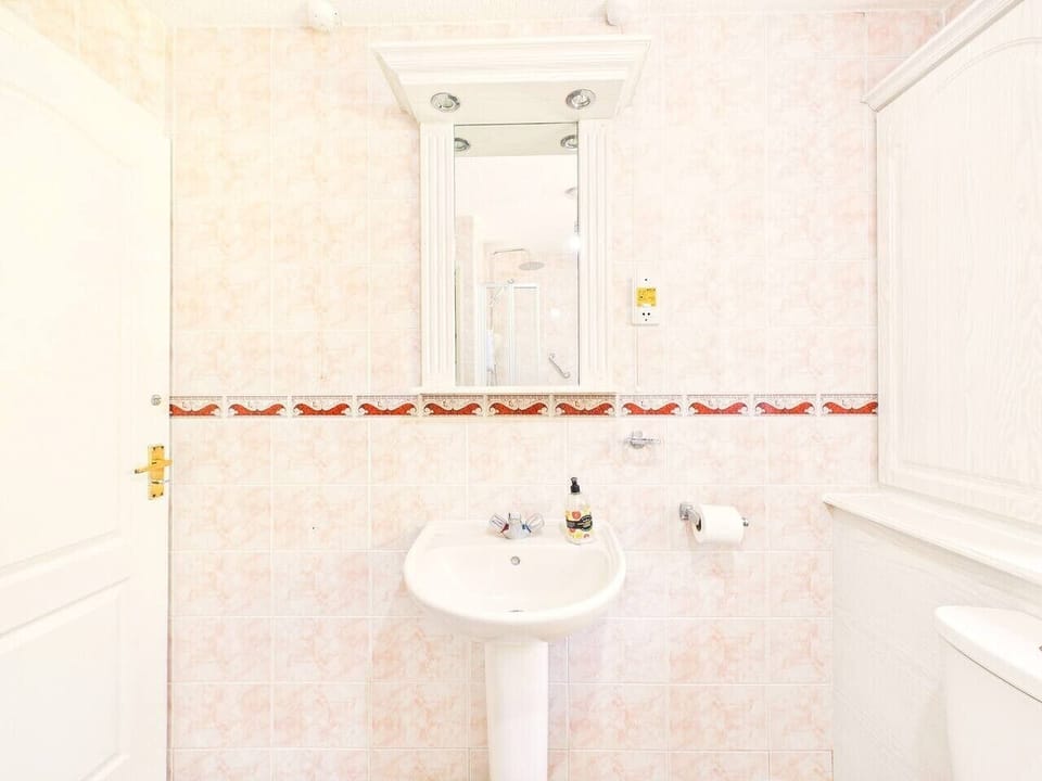 Bright bathroom with both a bathtub and separate shower for your comfort.