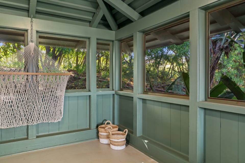 This cozy corner provides the perfect spot to read, relax, or simply enjoy the peaceful garden views.