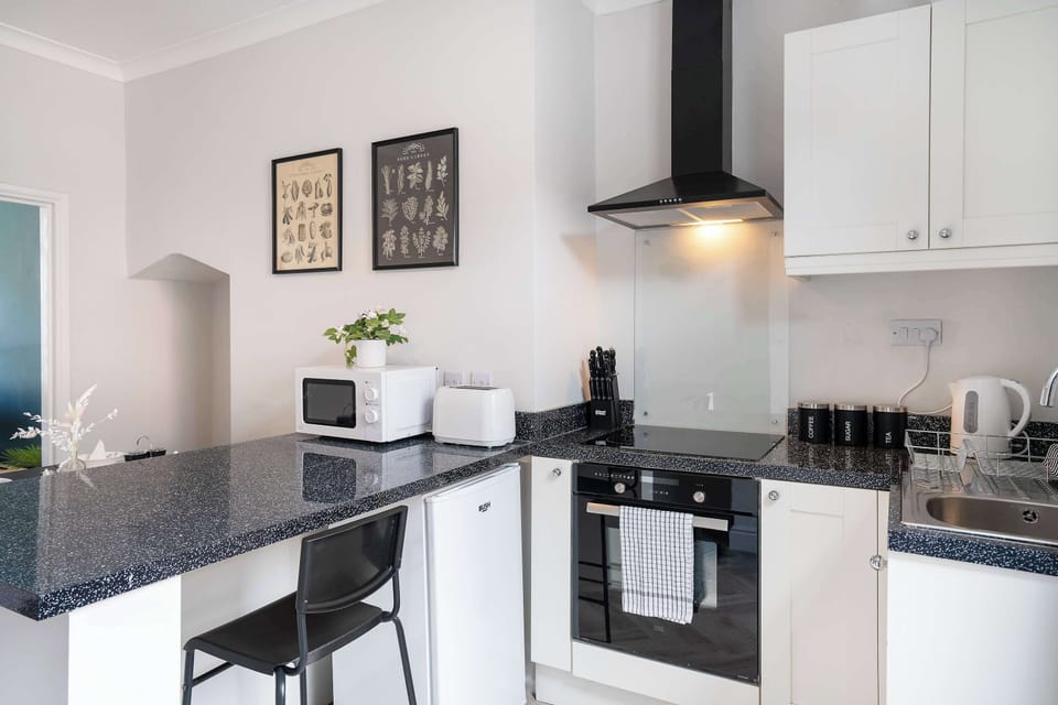 Quality cookware and sharp kitchen essentials make home cooking simple throughout your stay.