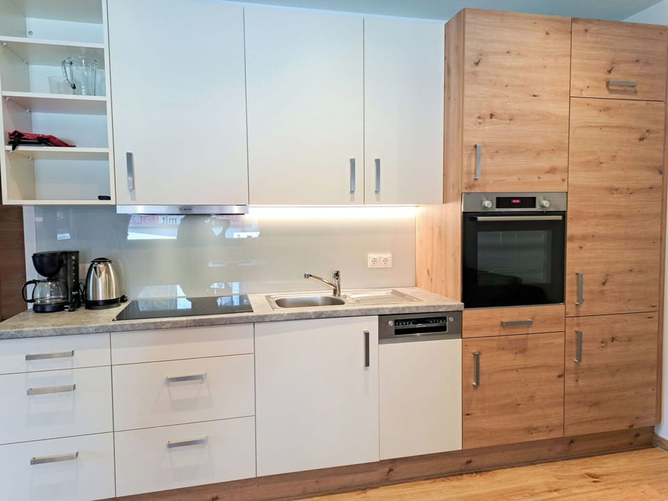 Cabinetry, Flooring, Kitchen Appliance, Countertop, Kitchen, Furniture, Wood, Interior Design, Major Appliance, Cupboard