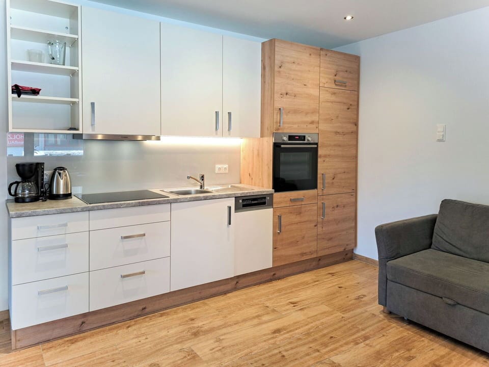 Furniture, Flooring, Cabinetry, Interior Design, Wood, Countertop, Floor, Kitchen, Wood Flooring, Kitchen Appliance