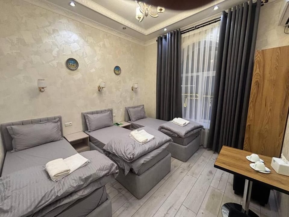 Standard Triple Room, City View | Desk, laptop workspace, soundproofing, WiFi (free)