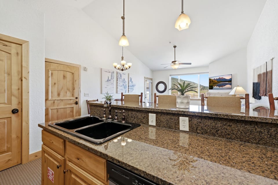 Spacious kitchen with granite countertops and breakfast bar.