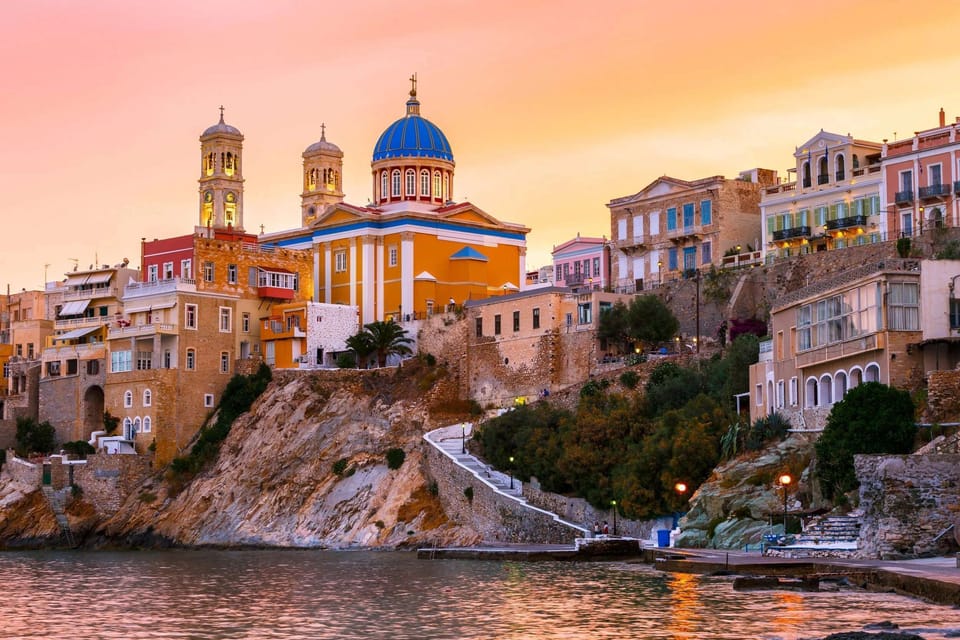 Ermoupoli, around 2 km away, with neoclassical waterfront mansions and lively island character.